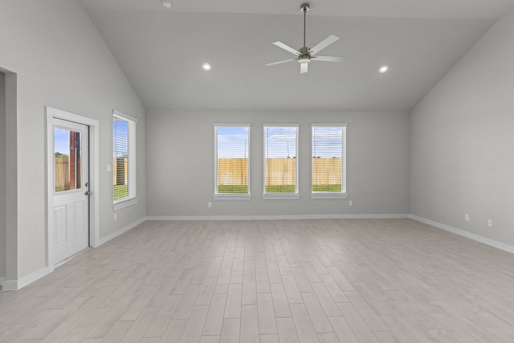 3102 Boulder Ridge Drive Rosenberg, TX 77471 - Photo 10 of 47 wooden floor in an empty room with a window