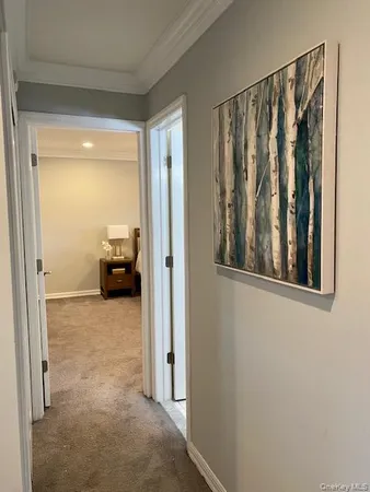 a view of a bedroom from a hallway