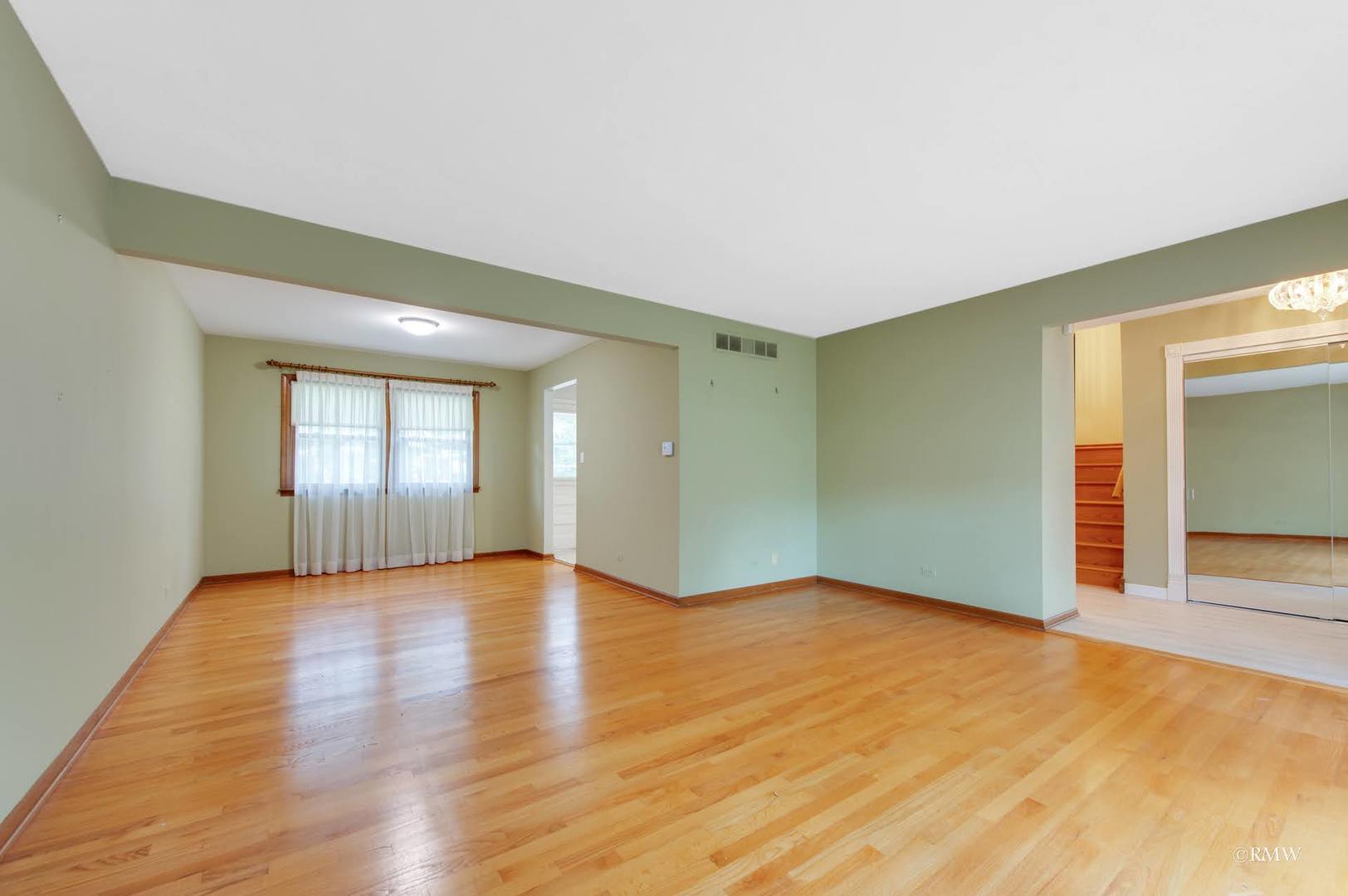 1906 McAdam Road Darien, IL 60561 - Photo 16 of 32 a view of an empty room with window and wooden floor
