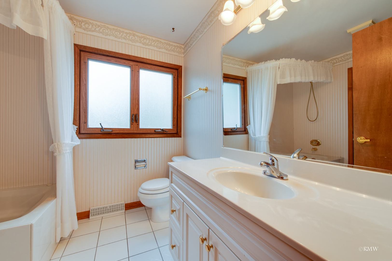 1906 McAdam Road Darien, IL 60561 - Photo 19 of 32 a bathroom with a sink toilet and shower