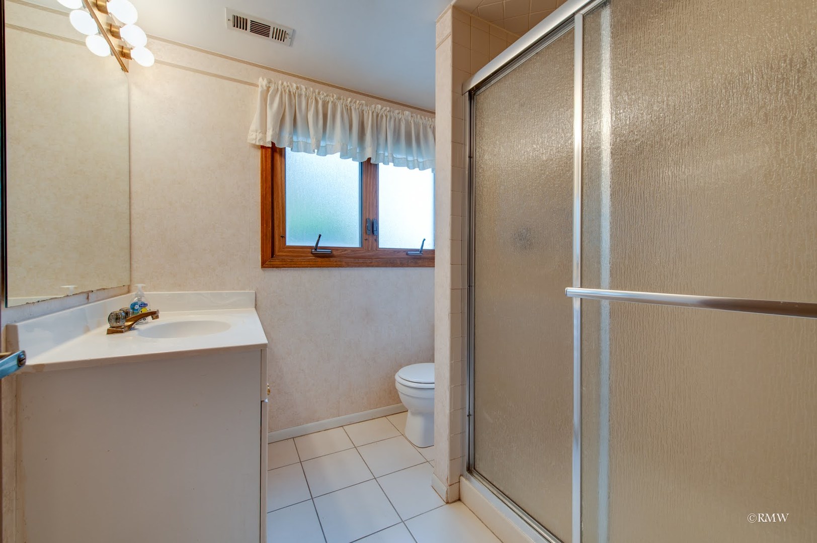 1906 McAdam Road Darien, IL 60561 - Photo 21 of 32 a bathroom with a sink toilet and shower