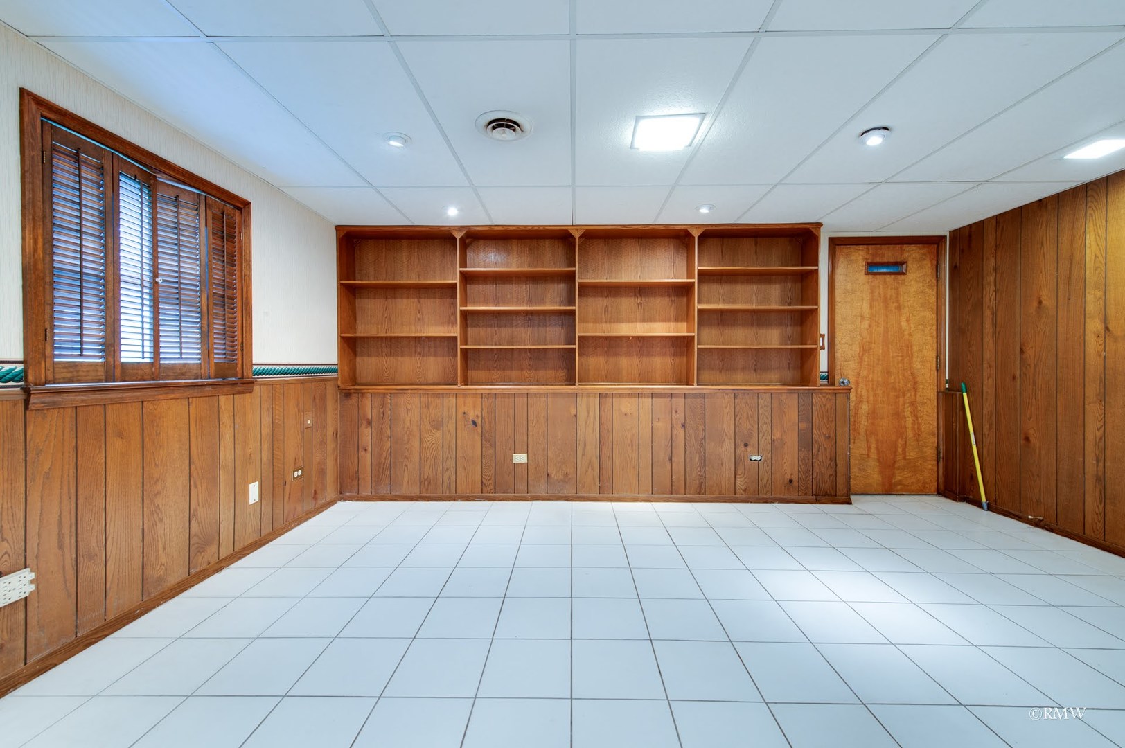 1906 McAdam Road Darien, IL 60561 - Photo 23 of 32 a view of an empty room with wooden shelves