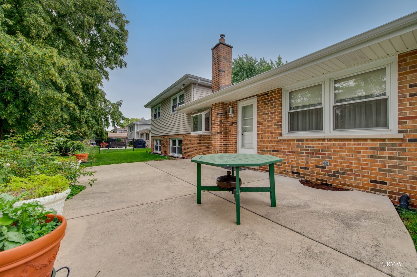 1906 McAdam Road Darien, IL 60561 - Photo 30 of 32 a view of a house with backyard and sitting area