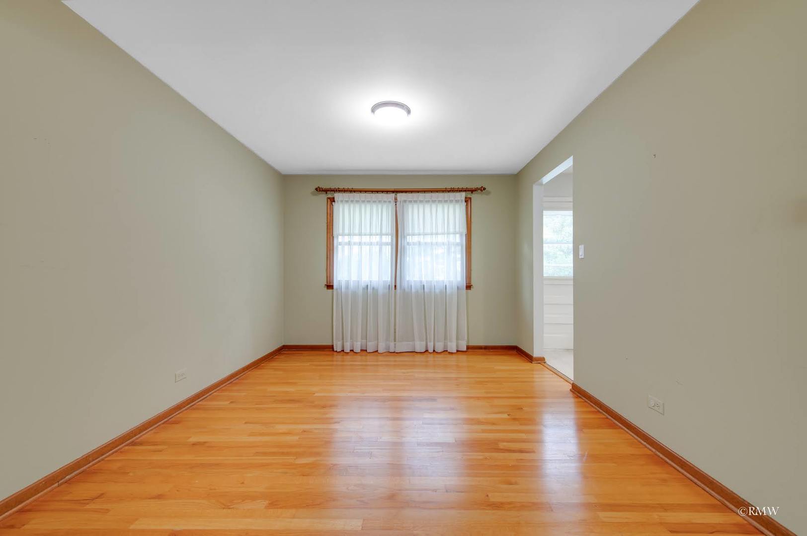 1906 McAdam Road Darien, IL 60561 - Photo 9 of 32 a view of an empty room and window