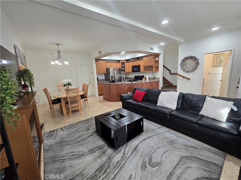 8026 Telegraph Road Downey, CA 90240 - Photo 7 of 26 a living room with furniture and a rug