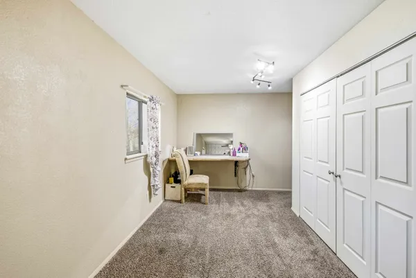 a view of room with furniture and a window