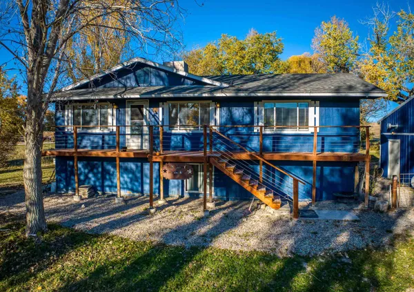 a view of a house with swimming pool and sitting area
