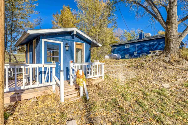a view of a house with wooden fence