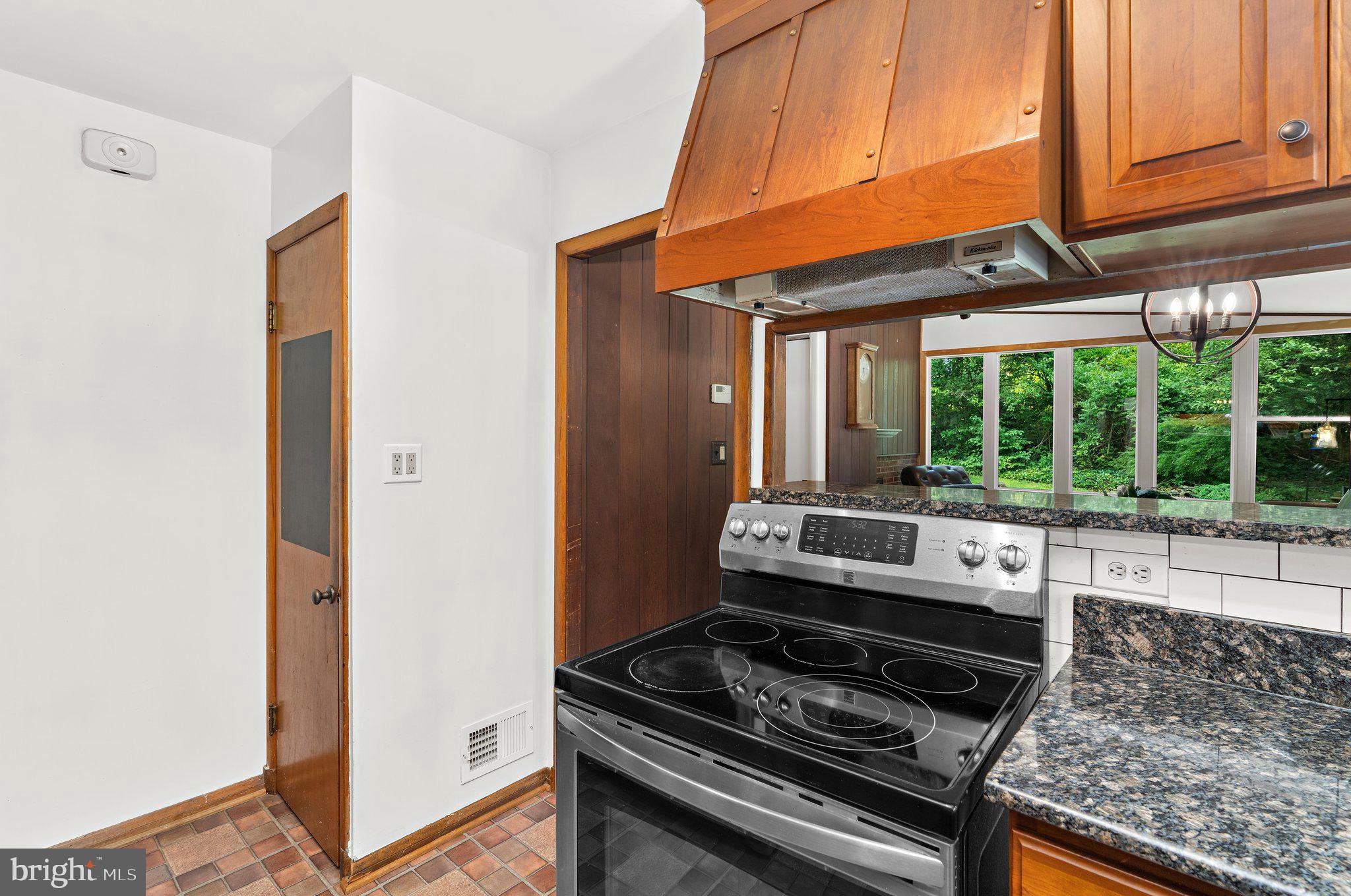 716 Andover Road Linthicum Heights, MD 21090 - Photo 12 of 48 a kitchen with stove and cabinets