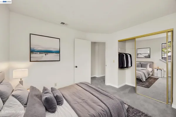 a bedroom with a bed and walk in closet