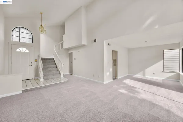 a view of an empty room with a fireplace