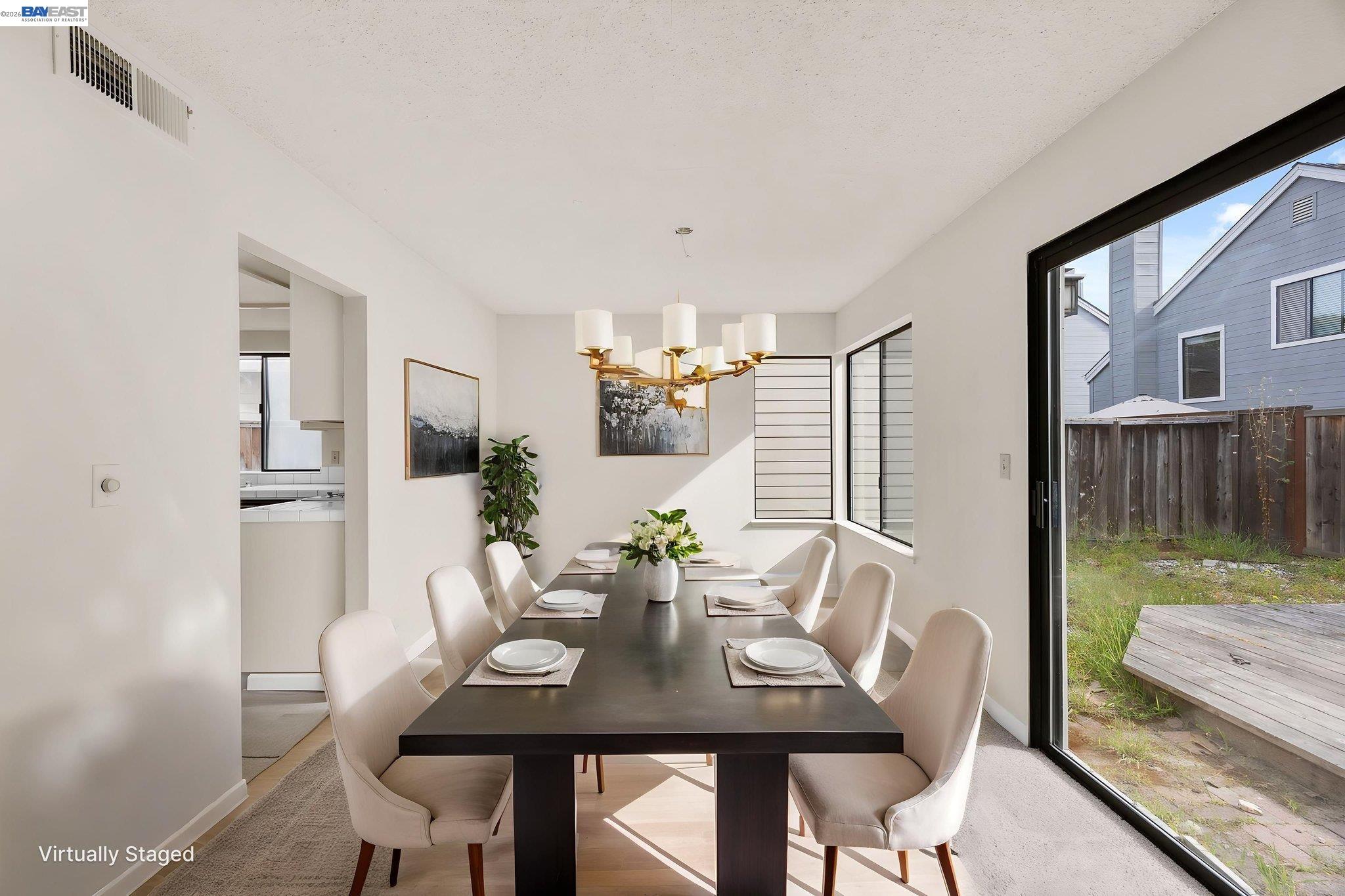 1068 Foster Street Alameda, CA 94502 - Photo 4 of 17 a view of a dining room with furniture window and wooden floor