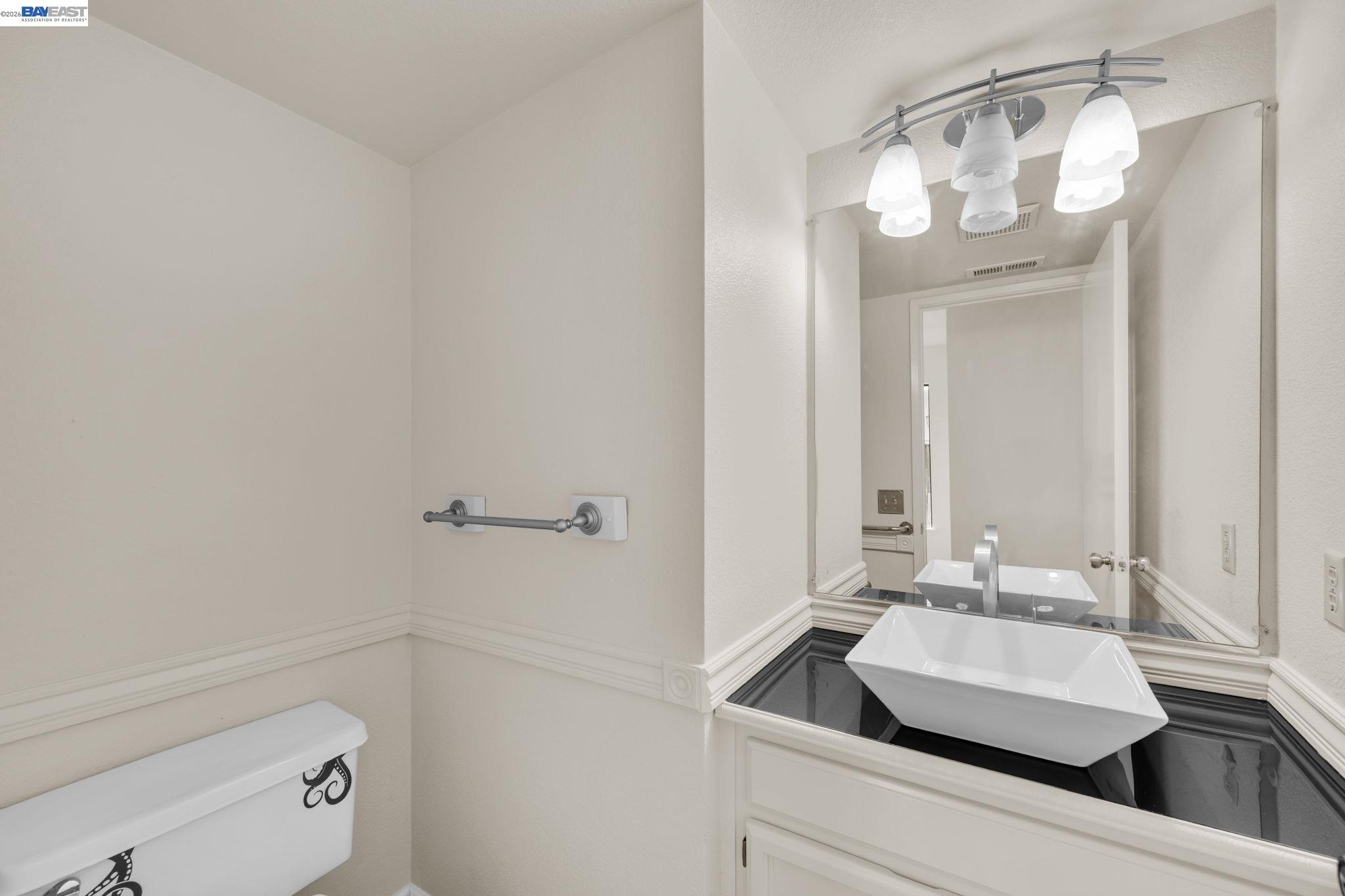 1068 Foster Street Alameda, CA 94502 - Photo 6 of 17 a bathroom with a sink and a mirror