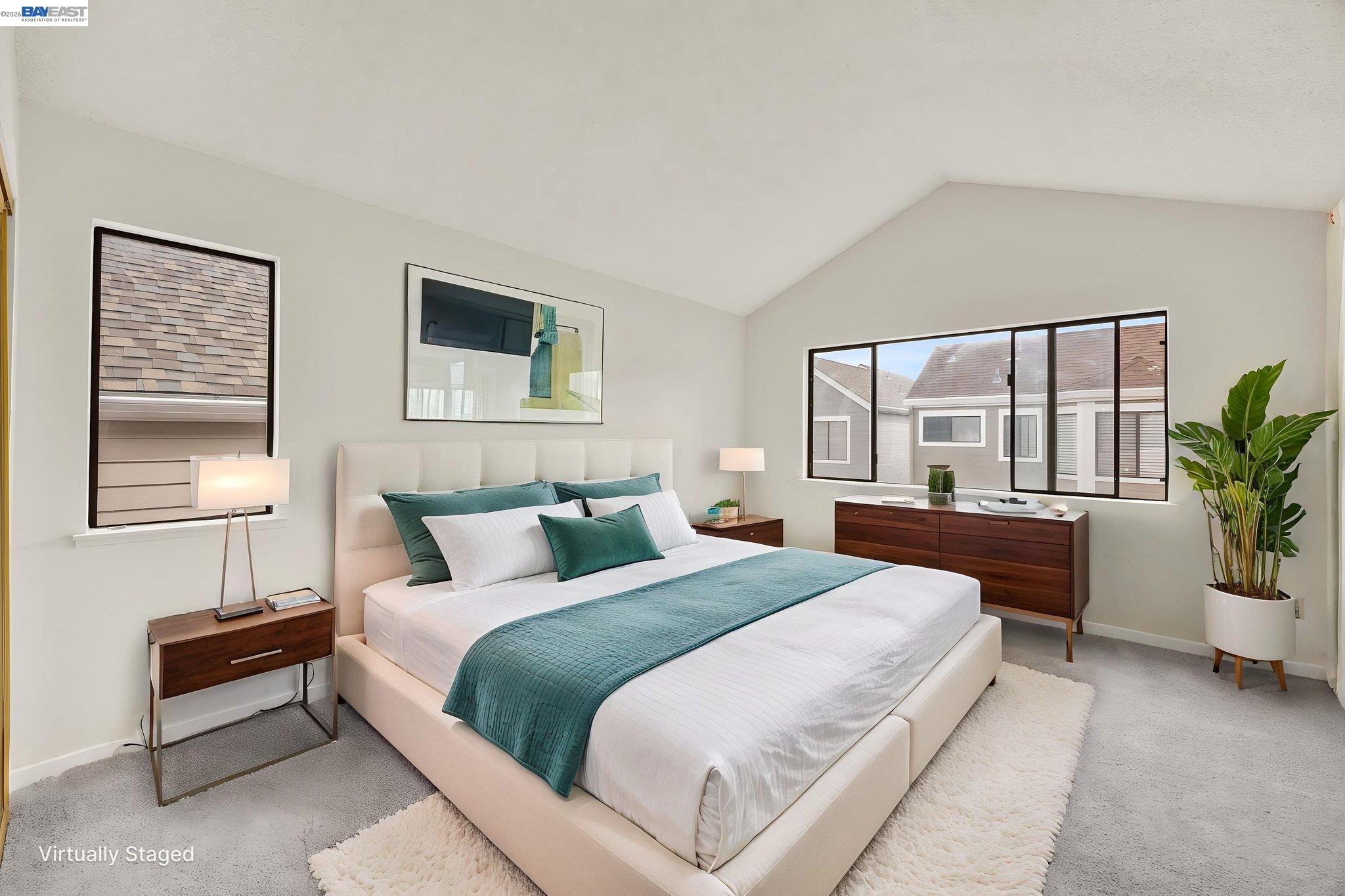 1068 Foster Street Alameda, CA 94502 - Photo 7 of 17 a bedroom with a large bed and a potted plant