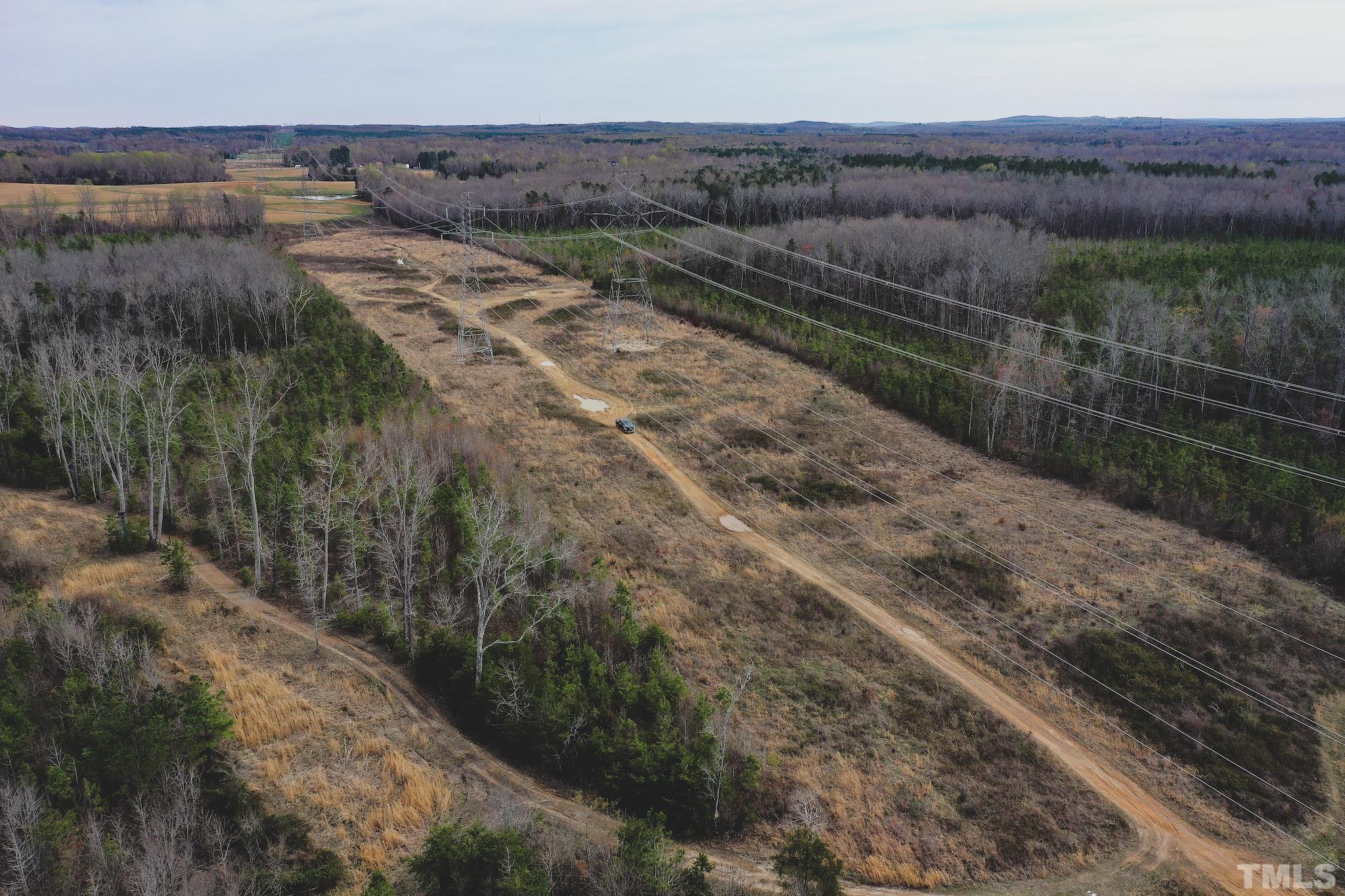 103-ac Pulliam-Tingen Mine Road Roxboro, NC 27574 - Photo 17 of 30 a view of a yard with wooden fence