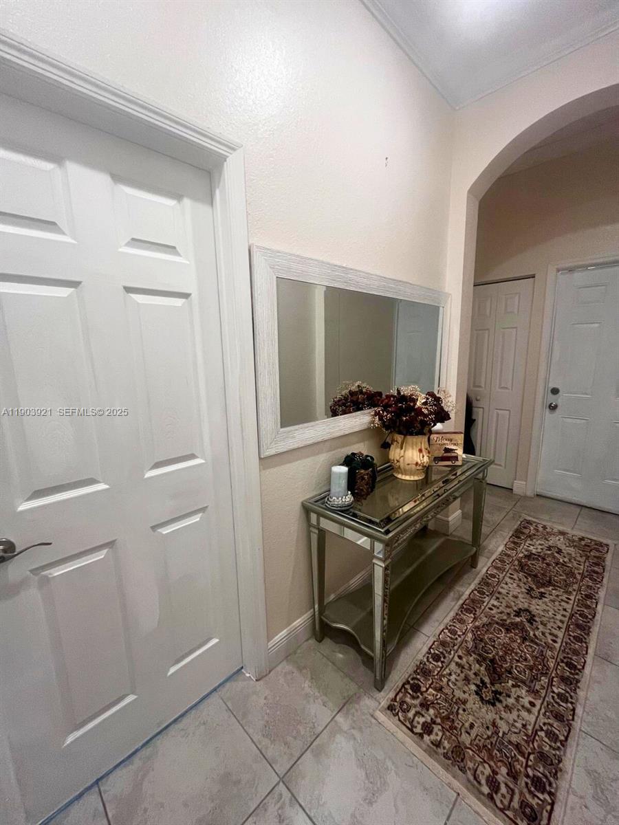 116 Northeast 25th Terrace Homestead, FL 33033 - Photo 2 of 9 a room with storage and utility