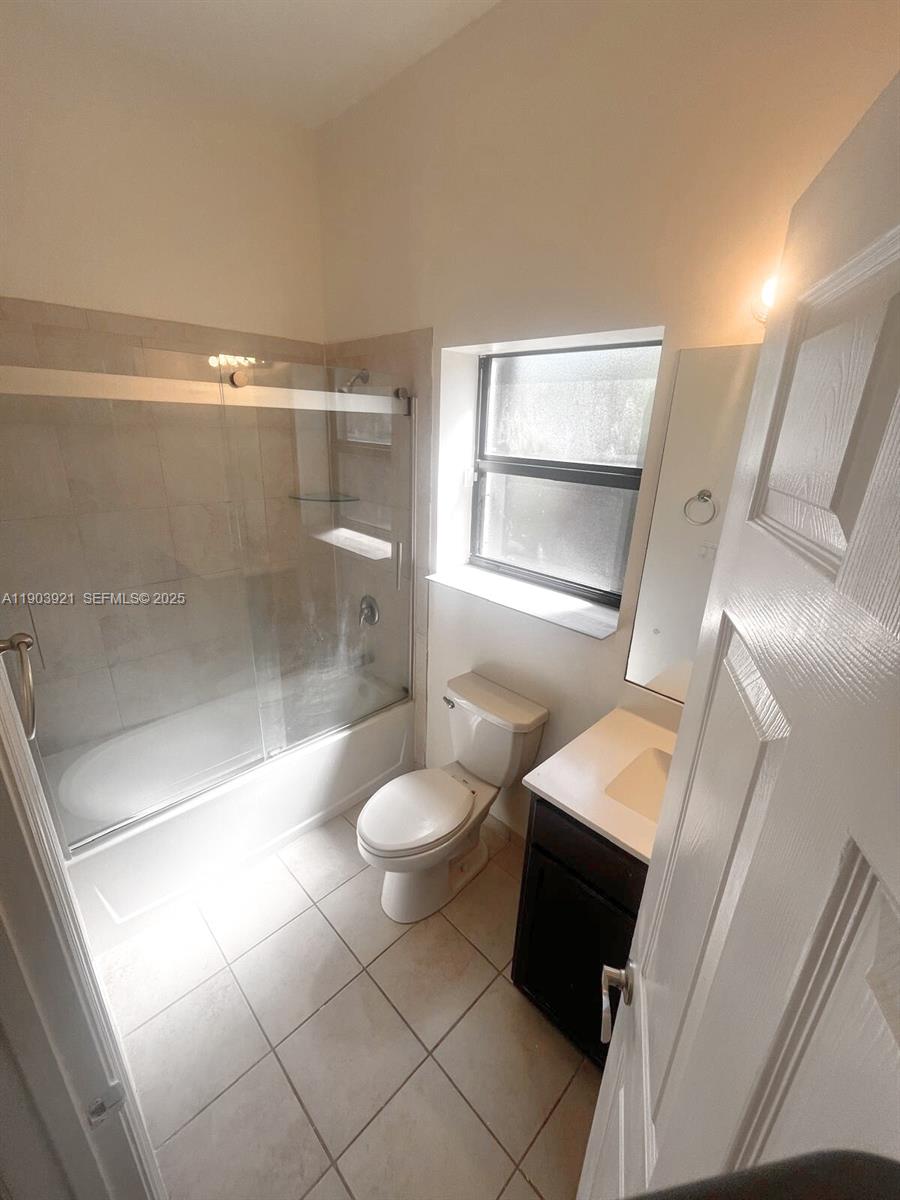 116 Northeast 25th Terrace Homestead, FL 33033 - Photo 8 of 9 a bathroom with a toilet and a shower