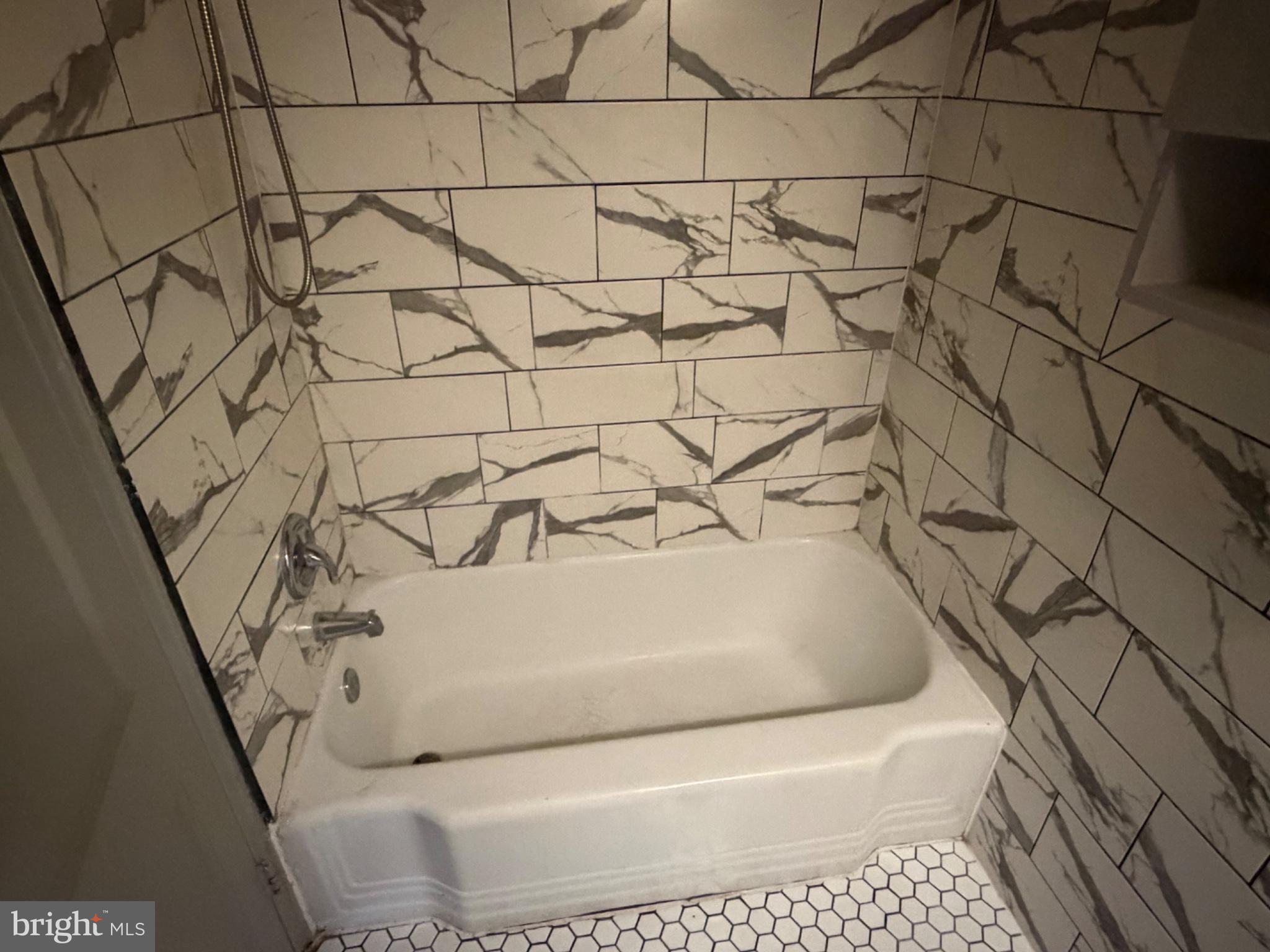 8300 Lynnewood Road Philadelphia, PA 19150 - Photo 7 of 11 Elegant marble-patterned bath retreat.