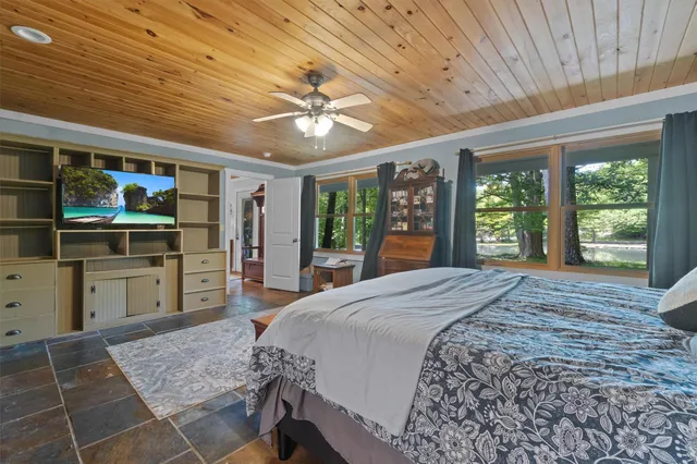 a spacious bathroom with a double vanity sink a mirror and a shower
