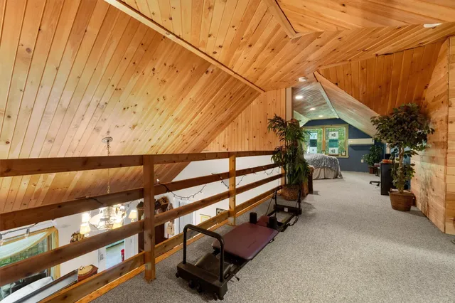 a bed room with a bed and a large window