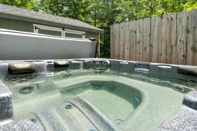an aerial view of a residential houses with outdoor space