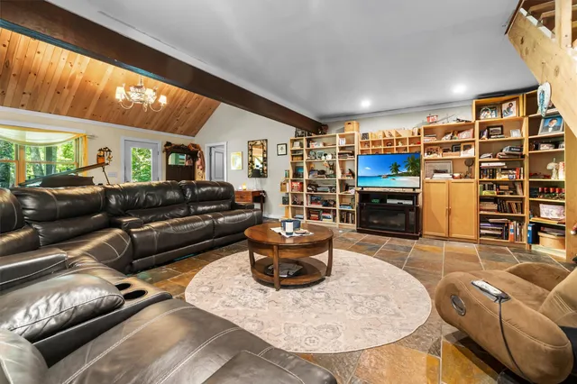 a dining table with chairs and window