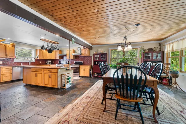 a view of a dining room with furniture window and outside view