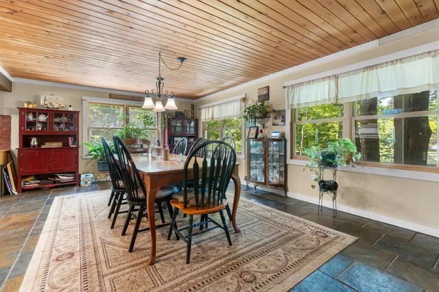 a kitchen with stainless steel appliances granite countertop a sink a stove and cabinets