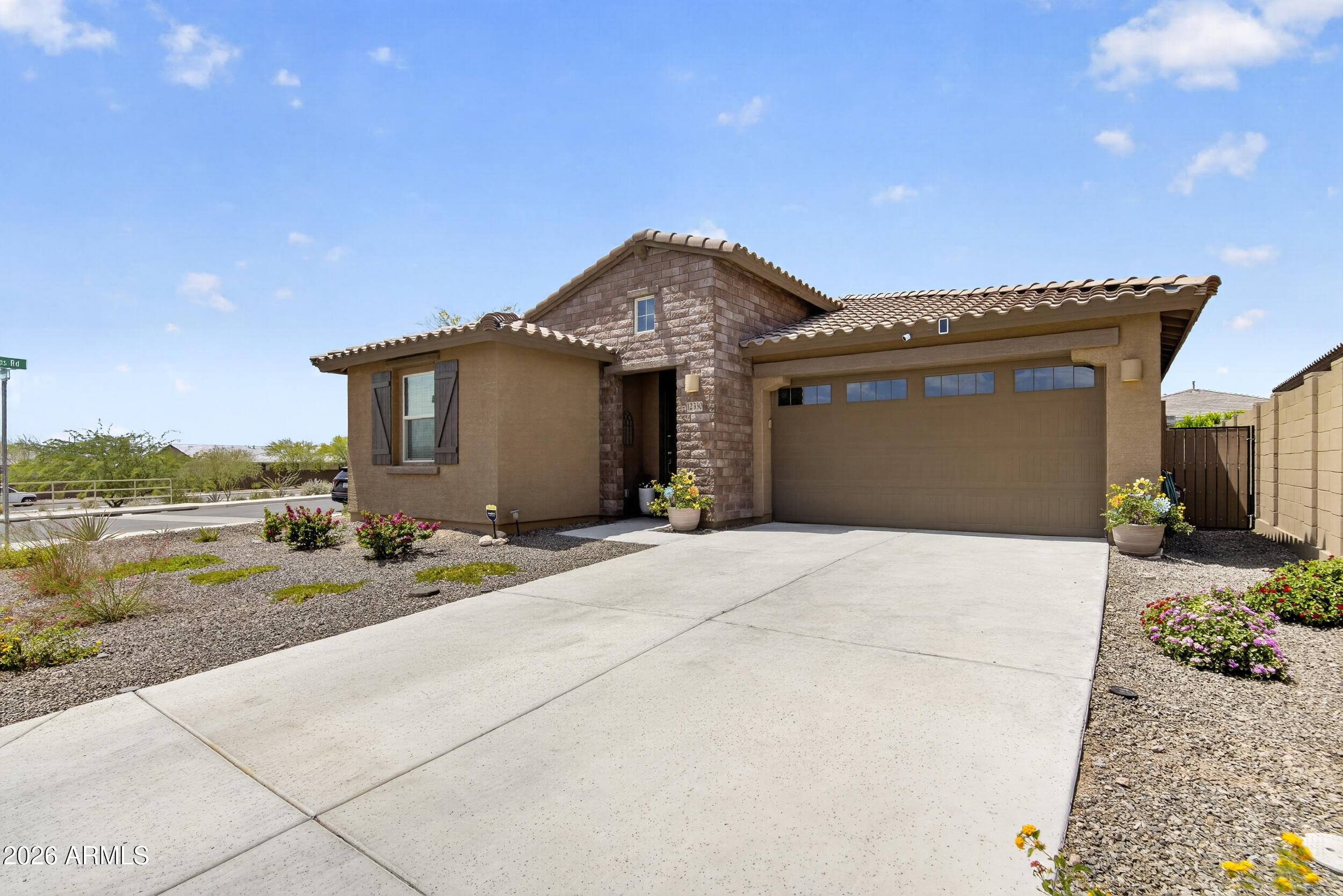 12330 East Soloman Road Gold Canyon, AZ 85118 - Photo 7 of 69 a front view of a house with a yard and garage