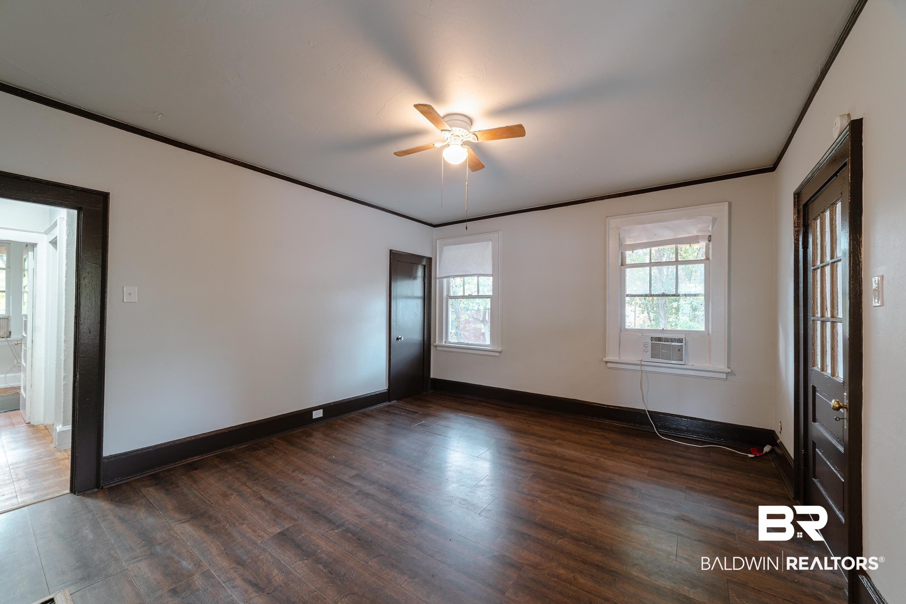 312 1st Street Mobile, AL 36611 - Photo 4 of 29 Spare room featuring dark wood-type flooring and ceiling fan