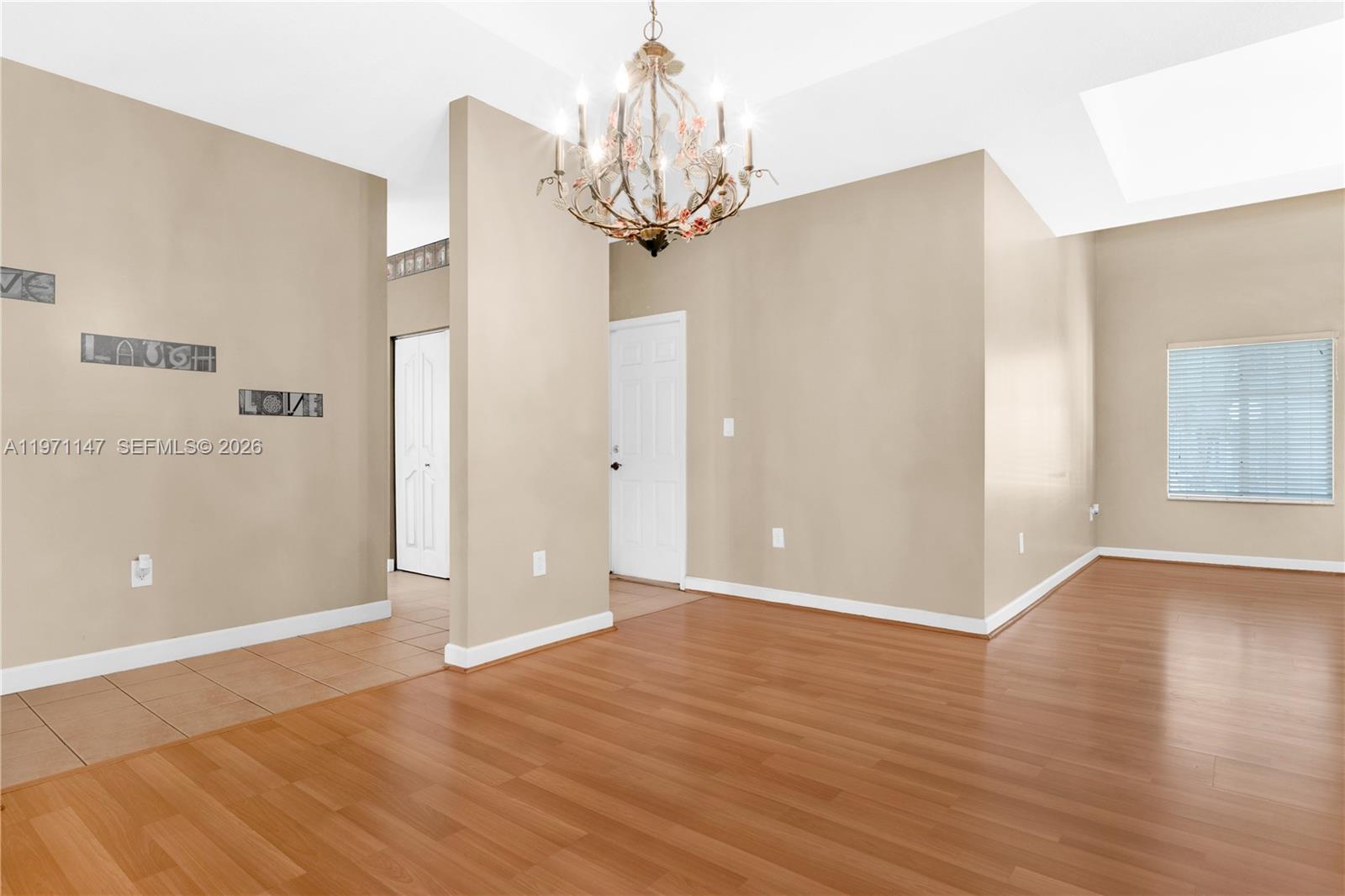 2875 Northeast 4th Street Homestead, FL 33033 - Photo 11 of 53 a view of a chandelier in big room and kitchen