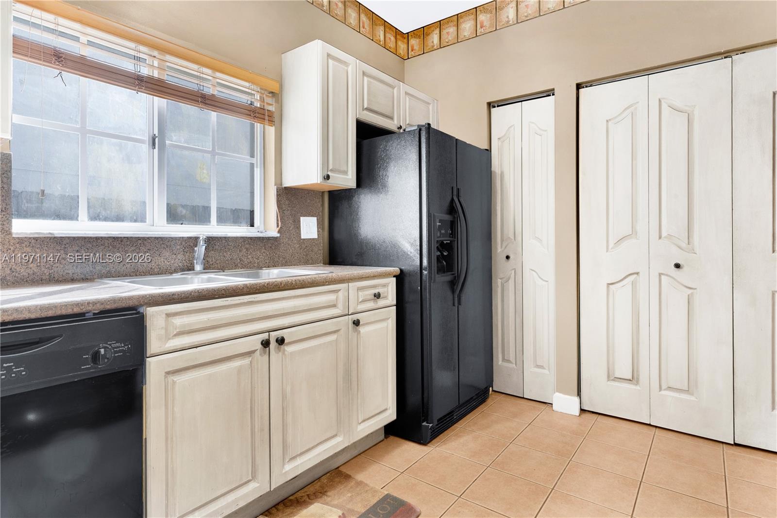 2875 Northeast 4th Street Homestead, FL 33033 - Photo 13 of 53 a kitchen with stainless steel appliances granite countertop a refrigerator and a sink