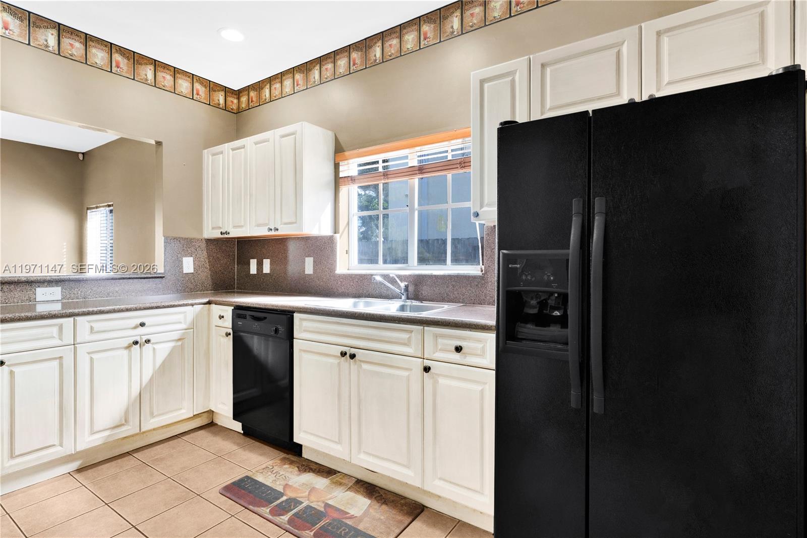 2875 Northeast 4th Street Homestead, FL 33033 - Photo 14 of 53 a kitchen with granite countertop white cabinets and refrigerator