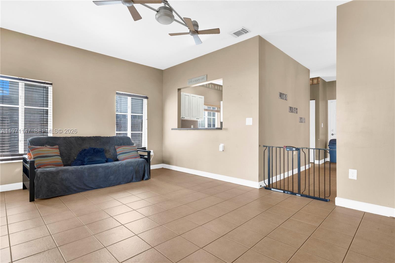 2875 Northeast 4th Street Homestead, FL 33033 - Photo 16 of 53 a living room with furniture and a window