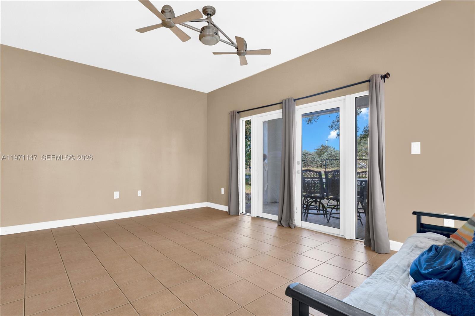 2875 Northeast 4th Street Homestead, FL 33033 - Photo 17 of 53 a view of an empty room with furniture and a window