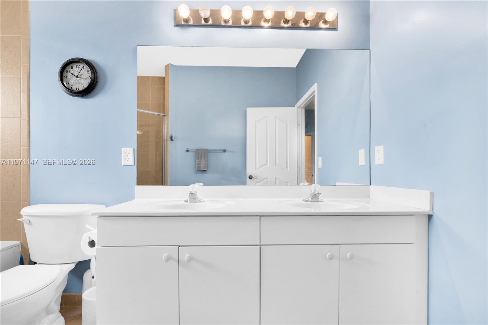 2875 Northeast 4th Street Homestead, FL 33033 - Photo 22 of 53 a bathroom with a sink and a mirror