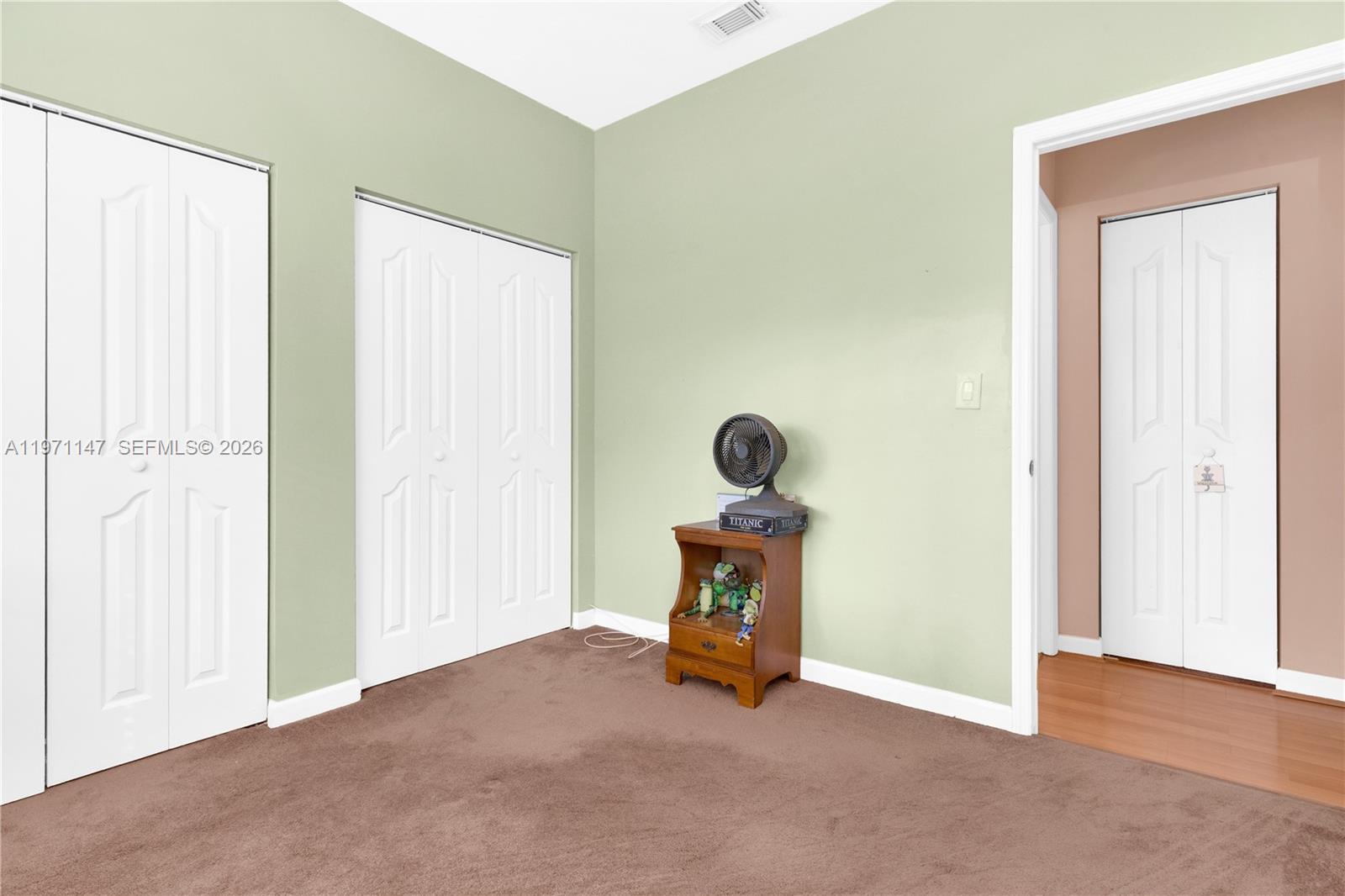 2875 Northeast 4th Street Homestead, FL 33033 - Photo 24 of 53 an empty room with wooden door