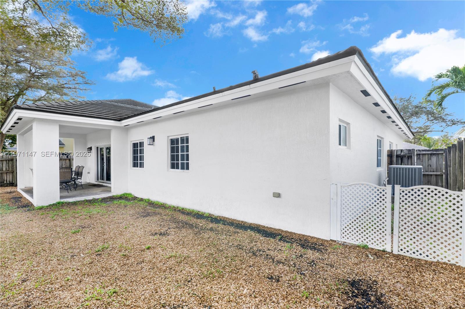 2875 Northeast 4th Street Homestead, FL 33033 - Photo 35 of 53 a view of a house with a backyard
