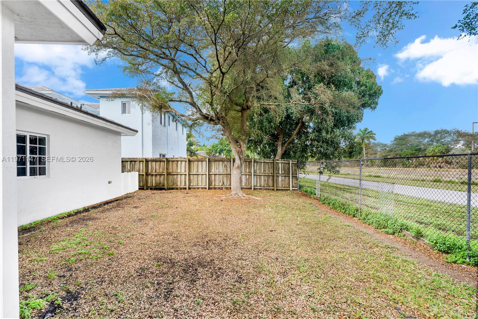 2875 Northeast 4th Street Homestead, FL 33033 - Photo 36 of 53 a view of backyard of house with trees