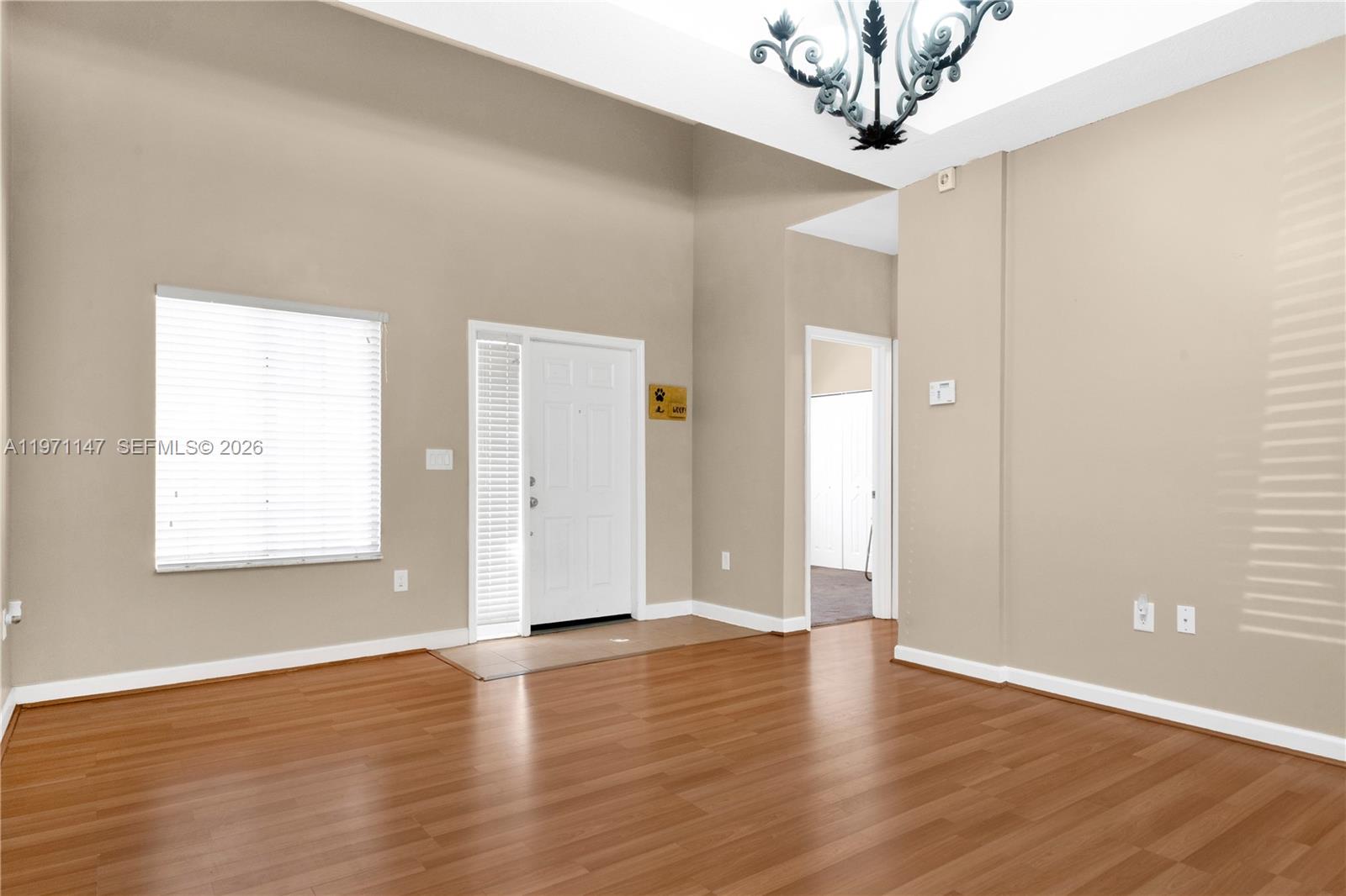 2875 Northeast 4th Street Homestead, FL 33033 - Photo 5 of 53 wooden floor in an empty room with a window