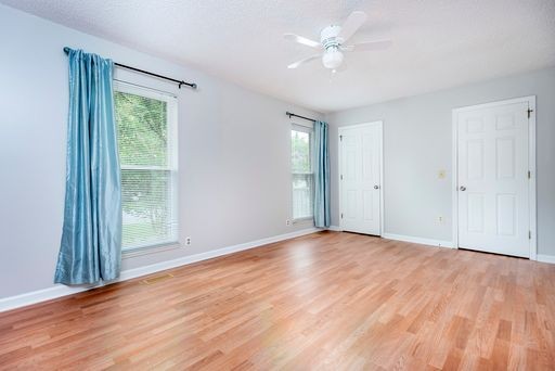 308 Cedarcliff Road Antioch, TN 37013 - Photo 11 of 20 a view of an empty room with wooden floor and a window