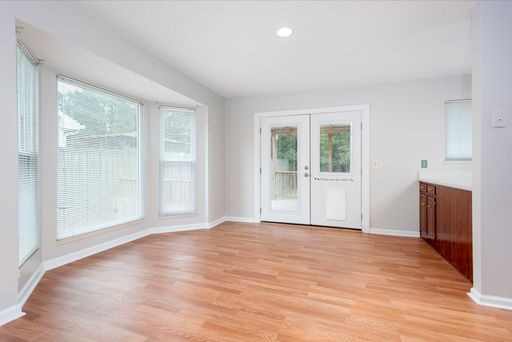 308 Cedarcliff Road Antioch, TN 37013 - Photo 6 of 20 a view of an empty room with wooden floor and a window
