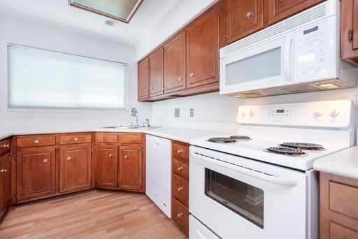 308 Cedarcliff Road Antioch, TN 37013 - Photo 8 of 20 a kitchen with granite countertop cabinets stainless steel appliances and wooden floor