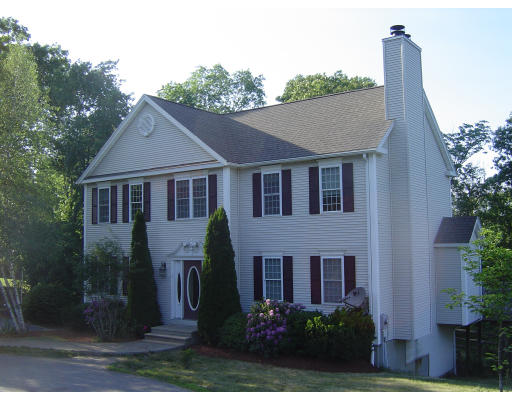 7 Leland Hill Road Sutton, MA 01590 - Photo 1 of 7 a front view of a house with garden