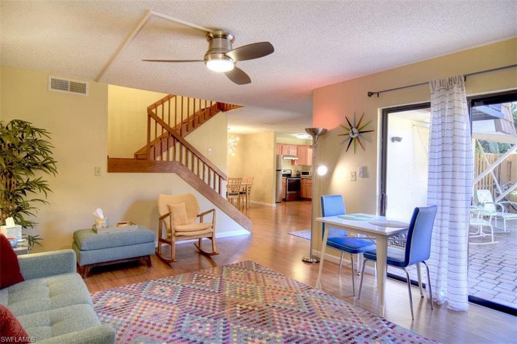 1468 Park Shore Circle, Unit 4 Fort Myers, FL 33901 - Photo 12 of 32 a living room with furniture and wooden floor