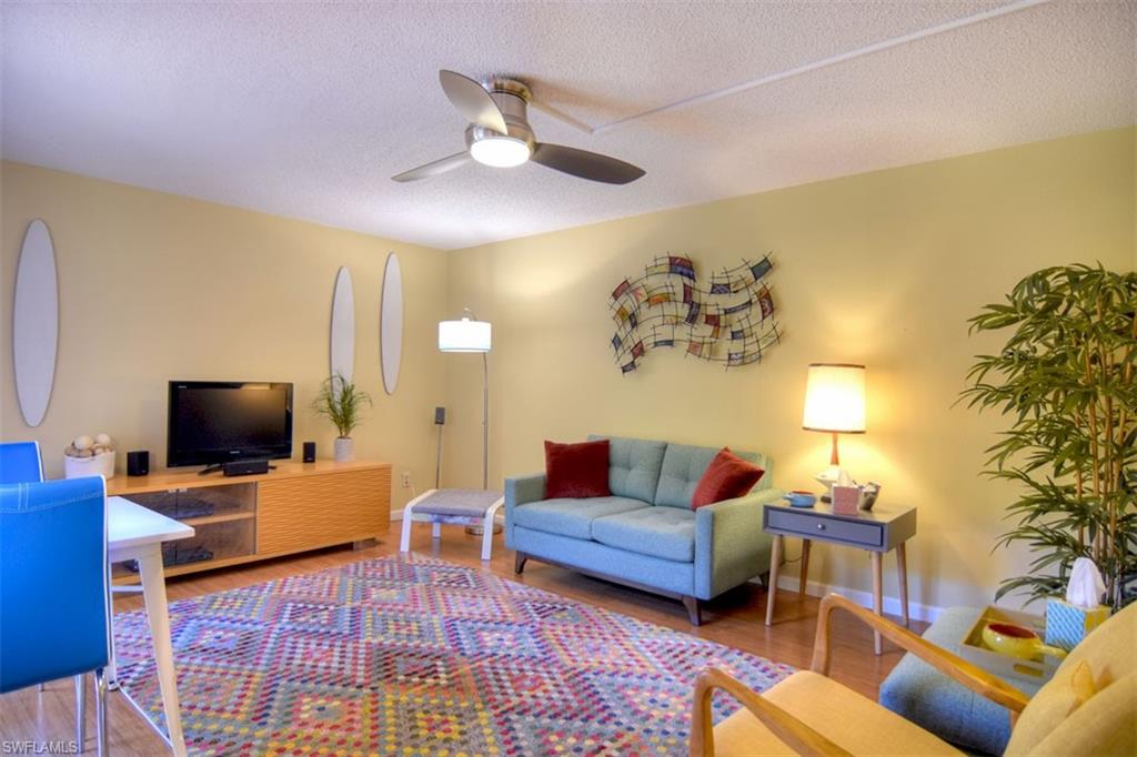 1468 Park Shore Circle, Unit 4 Fort Myers, FL 33901 - Photo 13 of 32 a living room with furniture and a flat screen tv