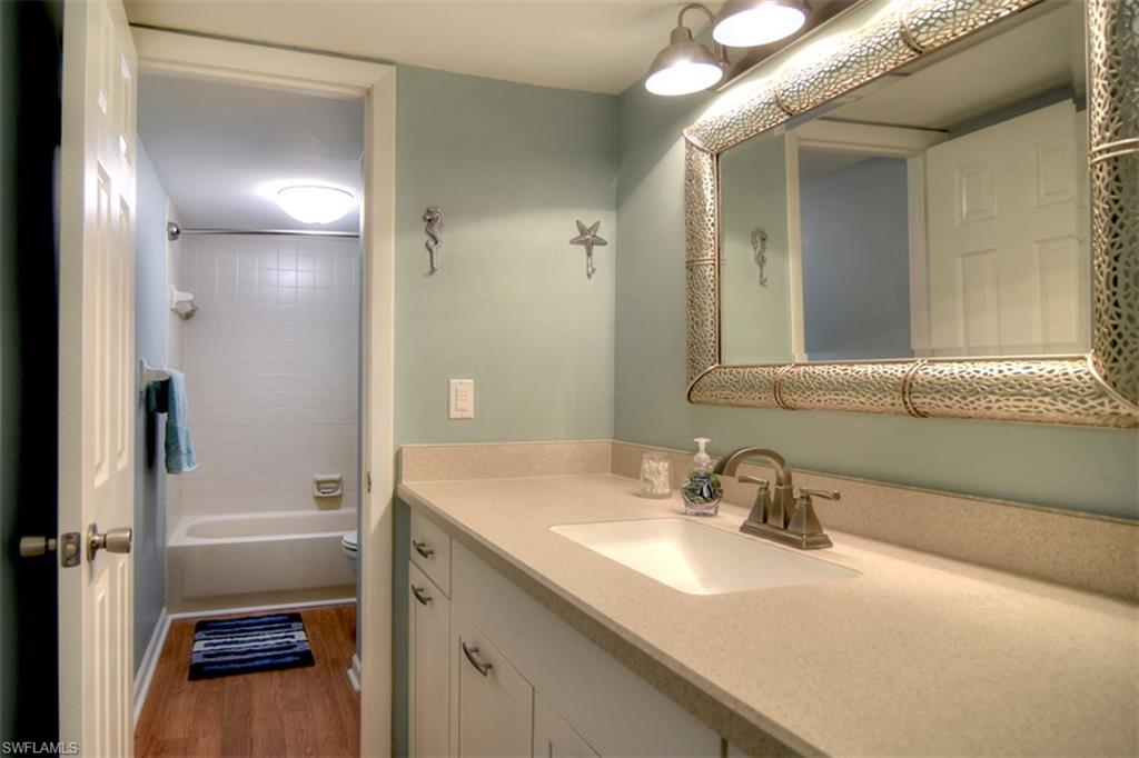 1468 Park Shore Circle, Unit 4 Fort Myers, FL 33901 - Photo 19 of 32 a bathroom with a sink a toilet and shower
