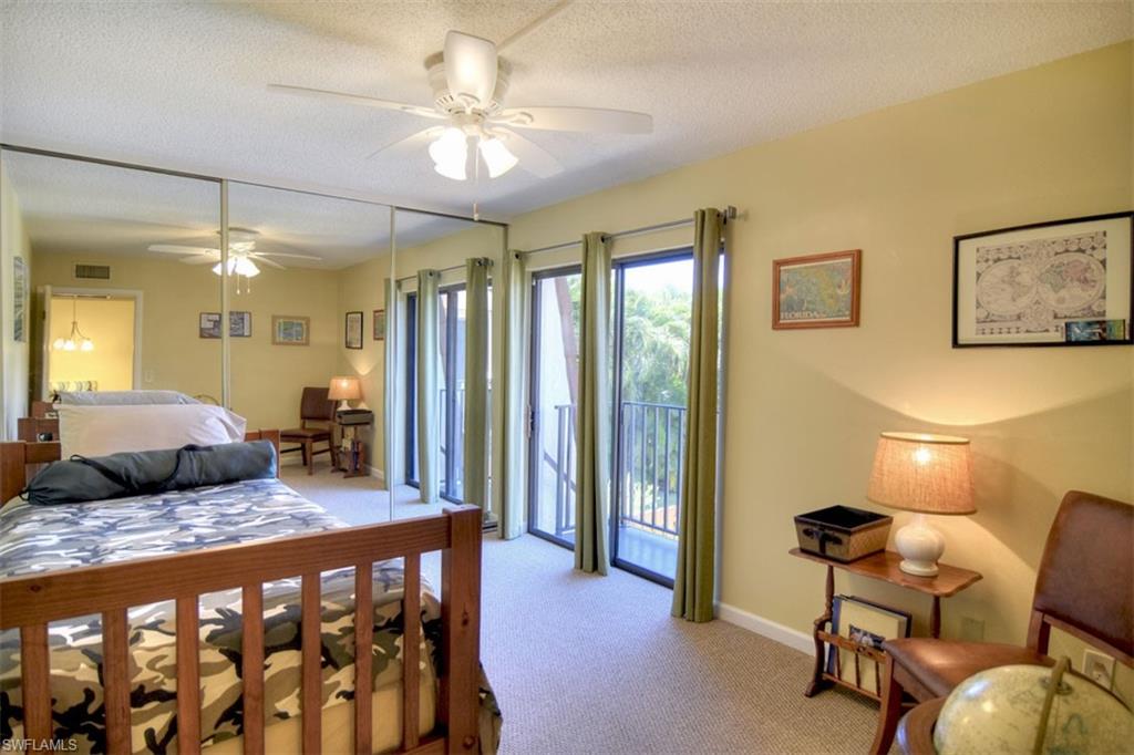 1468 Park Shore Circle, Unit 4 Fort Myers, FL 33901 - Photo 28 of 32 a bedroom with a bed and furniture