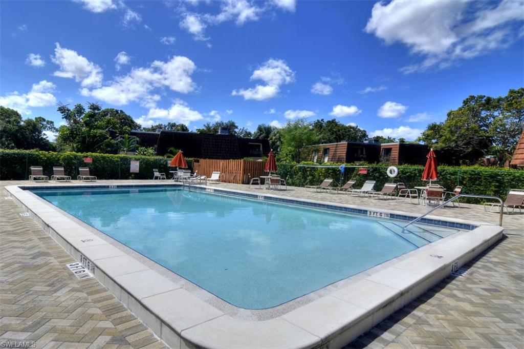 1468 Park Shore Circle, Unit 4 Fort Myers, FL 33901 - Photo 31 of 32 a view of a swimming pool with outdoor seating