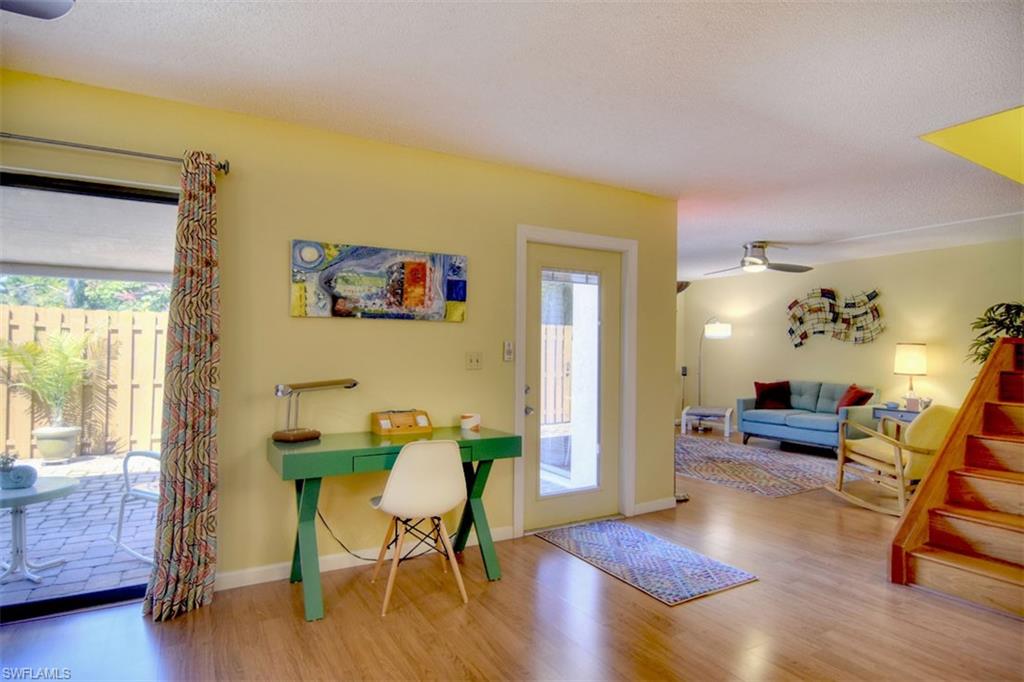 1468 Park Shore Circle, Unit 4 Fort Myers, FL 33901 - Photo 5 of 32 a view of a livingroom with furniture and wooden floor